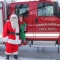 Santa and his elf, beside an Eagle Grove Fire Department truck.