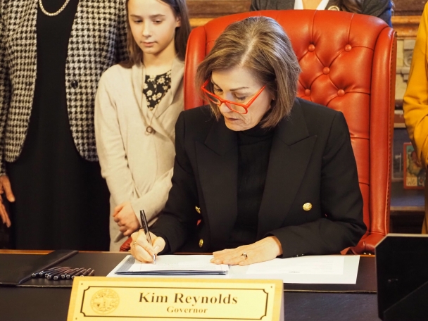 Kim Reynolds signed into law a bill removing the state’s gender-balance requirement